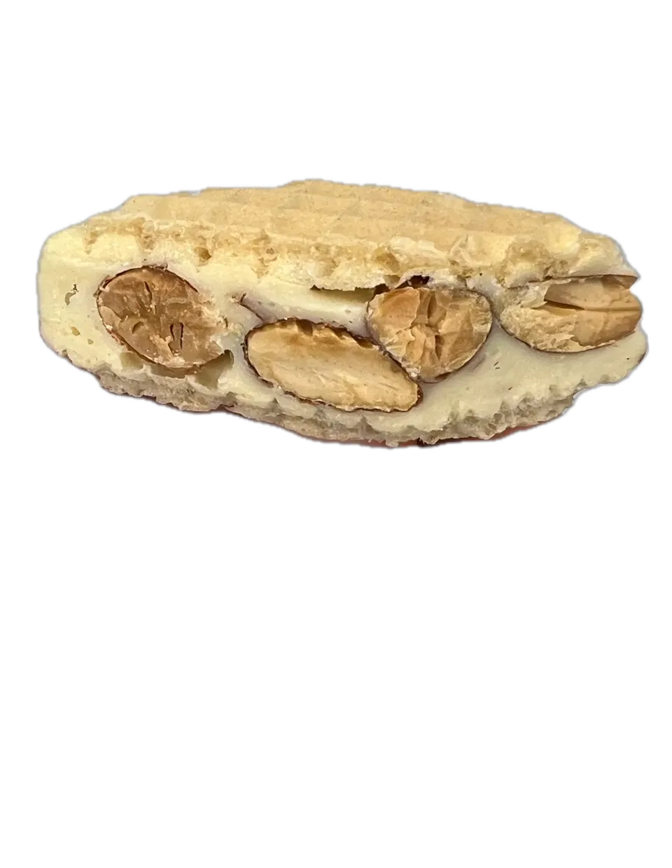 Close-up of a White Chocolate & Roasted Almond Toroon showing whole almonds in white chocolate nougat between wafers